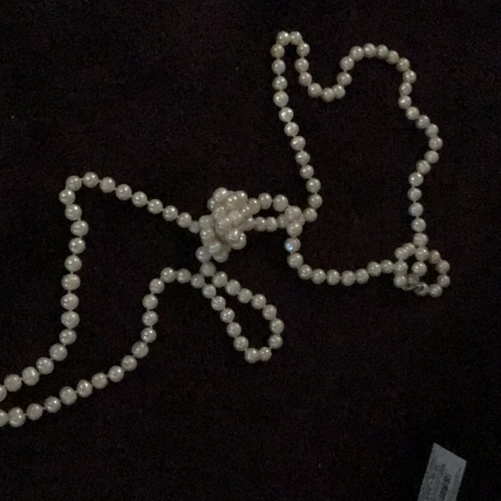64 inch opera length real pearls.